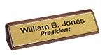 2 x1 0 Nameplate w/2 lines and wood triangle base Engraved, Engraver, Engraving, Etched, Name Plates, Identity tags, Identifiers,
Office signs, Signage, Laser, Lasered,  Carved, Ceramark, Lazered, Idaho,
Custom, personalized, full color, Business Logos,
